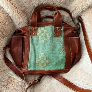 Moonwater Co. leather and Moroccan cactus silk pillow bag.